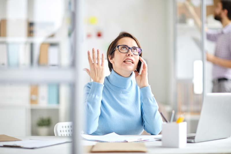 A local business woman is frustrated while waiting on hold for international vendor support. Get the support you deserve from CenturyAV.com.